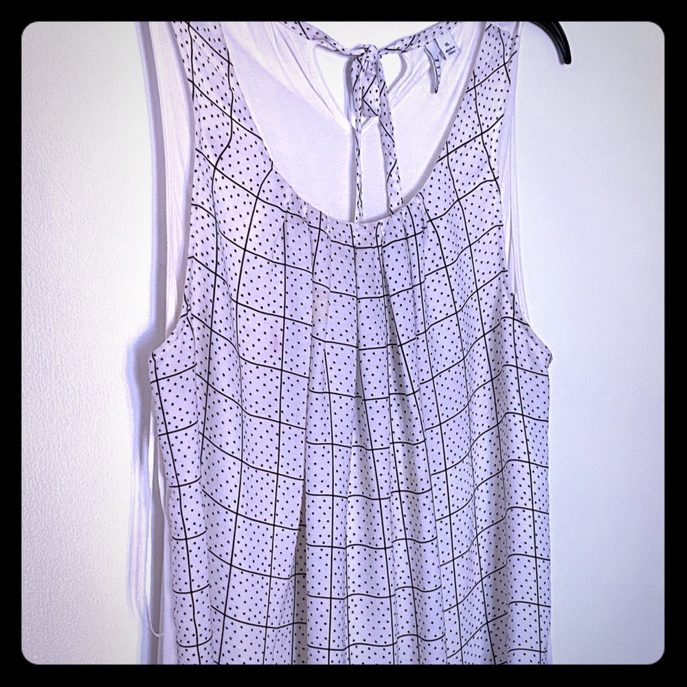 White black polkadot blouse .